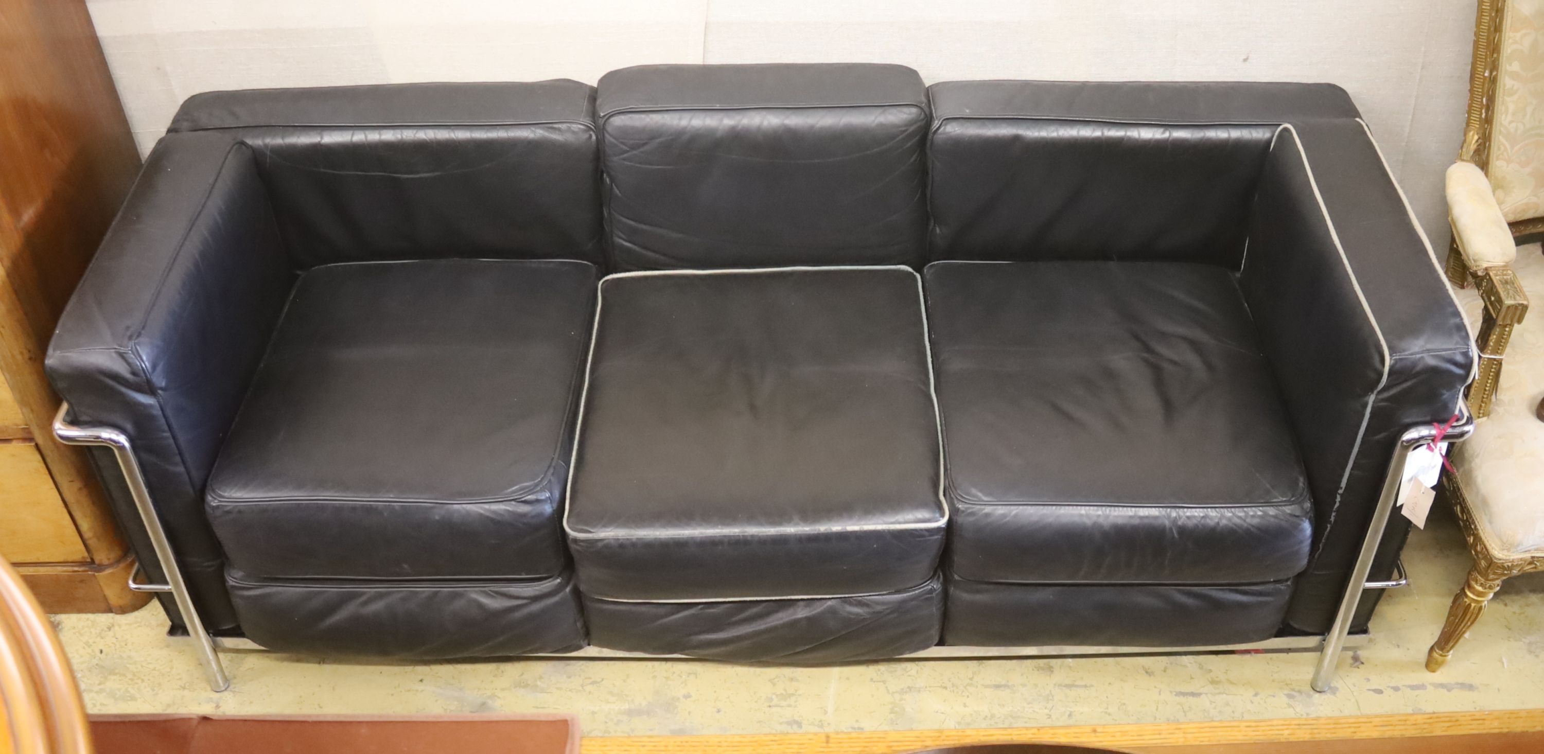 A Harrods Corbusier style chrome and black leather three seater settee, length 180cm, depth 69cm, height 67cm